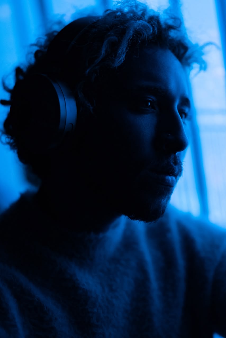 Ibrahim Donia in profile, wearing headphones